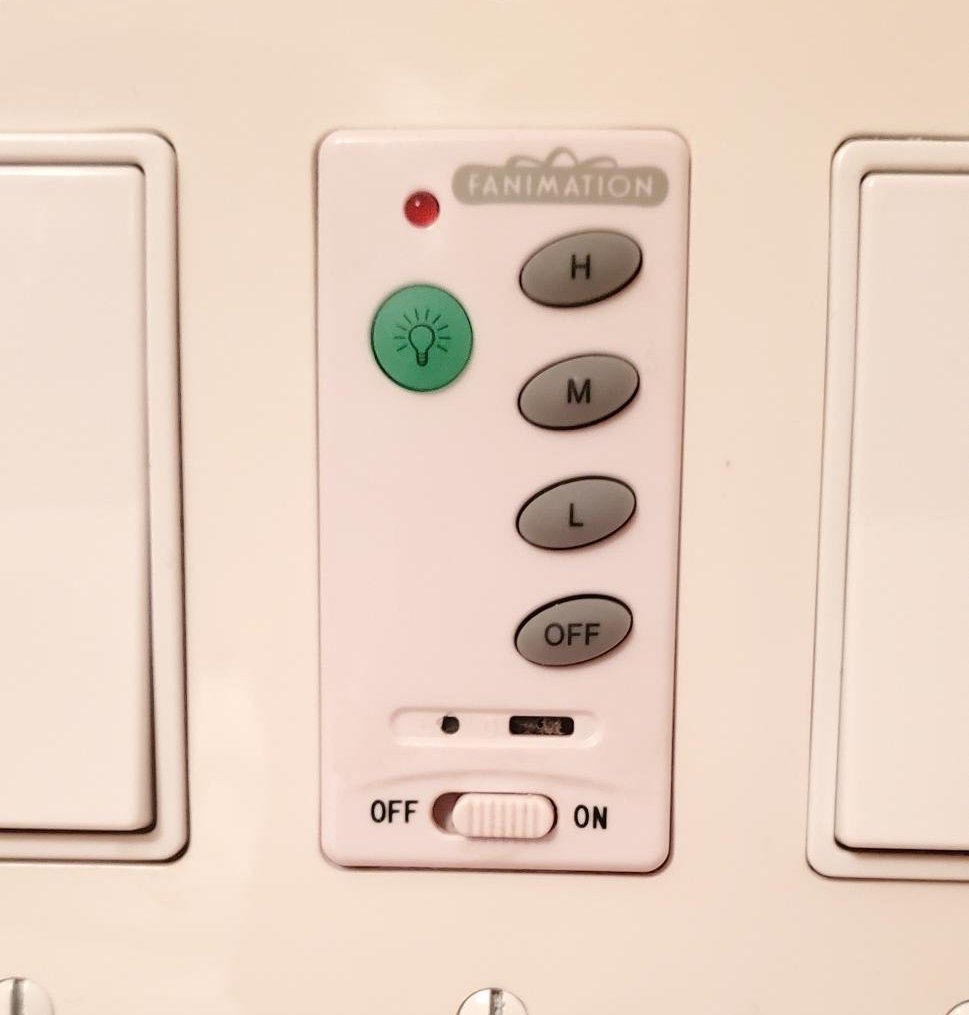 A light switch followed by a panel with a toggle button followed by another lightswitch